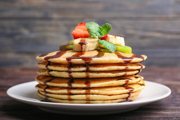 Stack of tasty sweet pancakes on plate