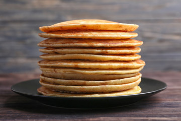 Stack of tasty pancakes on plate