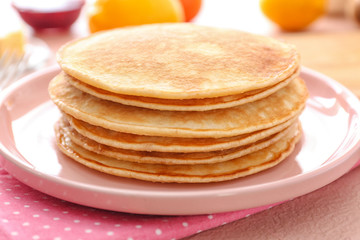 Stack of tasty pancakes on plate