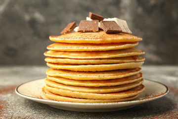 Stack of tasty sweet pancakes on plate