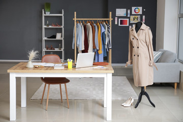 Modern workplace of clothes stylist in office