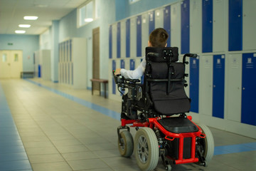 Fototapeta na wymiar A disabled student in a wheelchair in primary school.