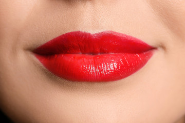 Young woman with red lipstick, closeup