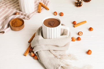 Cup of hot chocolate on white wooden table