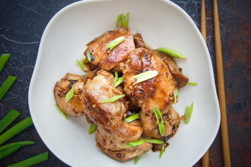 Sichuan chicken, Asian cuisine on dark background