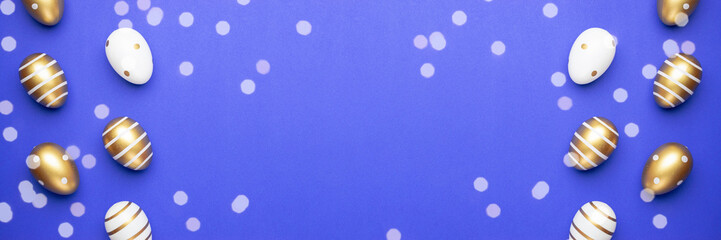 Happy Easter golden shine decorated eggs in basket isolated on blue background. For greeting card, promotion, poster, flyer, web-banner, article.