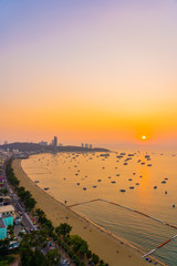 Beautiful tropical beach sea ocean bay with architecture building and ship around pattaya city