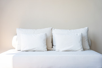 Fototapeta na wymiar Comfortable pillow on sofa decoration interior