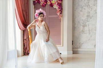 Fototapeta premium beautiful smiling girl with flowers in her hair