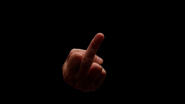 Male hand showing gesture isolated on black background