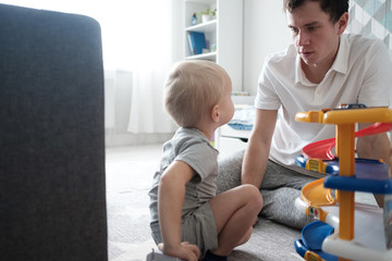 Man and boy play together. Family and childhood concept.