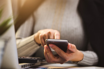 businesswoman hand working with new modern computer using on smartphone and tablet as concept