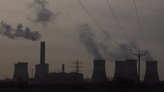 Industrial landscape in the north of England with chimneys and turbines UK 4K
