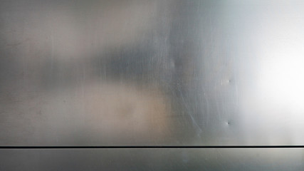 metal surface with a glossy silver texture with highlights