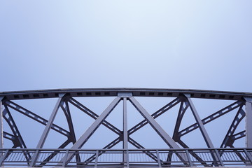 Steel bridge across the river and the sky in the summer.