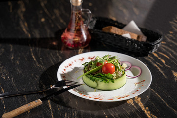 healthy salad with greens with cucumber tomato onion, restaurant serving, paired serving