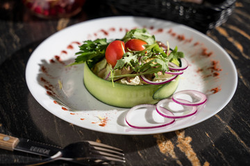 healthy salad with greens with cucumber tomato onion, restaurant serving, paired serving