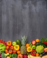 Obraz na płótnie Canvas Dieting and healthy eating concept: fruits, vegetables, vegan food ingredients over natural background.