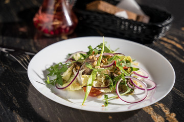 Siberian salad with herbs and pine nuts