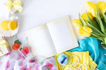 Colorful summer women fashion flat outfit. Dress, sunglasses, flowers on a white background, top view, wide composition. Summer fashion, vacation concept