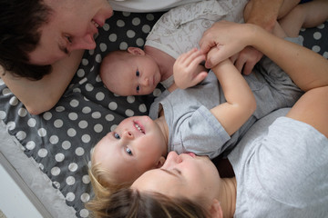 Obraz na płótnie Canvas Happy family with newborn baby