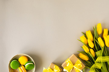 Beautiful flower arrangement. Yellow flowers tulips, empty frame for text on a white background. Wedding. Birthday Valentine's Day. Mothers Day. Flat lay, top view, copy space