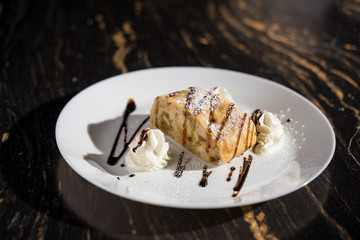 dessert apple strudel with a scoop of ice cream