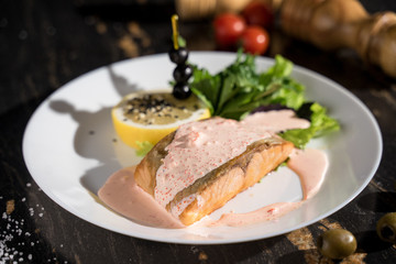 baked trout fish poured with sauce, serving, hot dish, healthy food