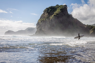 Surfer at Piha surf beach