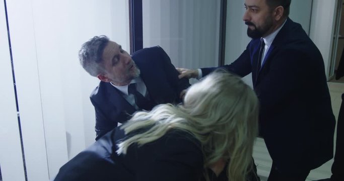 Coworkers running to help ill manager