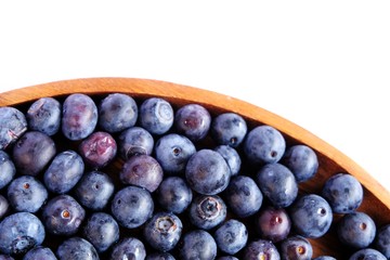 fresh blueberries in Wooden tray isolated on white background.