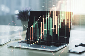 Multi exposure of abstract creative financial graph on modern computer background, forex and investment concept