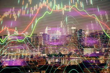 Double exposure of forex chart drawings over cityscape background. Concept of success.