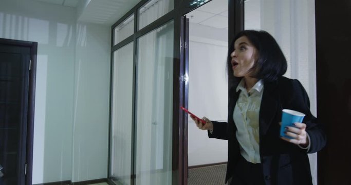 Preoccupied business people colliding in office corridor