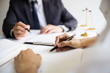 lawyer consulting with client discussing about lawsuit..