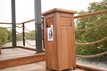 Wooden Dustbin box in Abu Dhabi Mangrove Park.Modern eco trash bin.Dump your waste in proper place.Day time photography with Nikon.March 14th 2020.