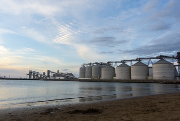 Silos and pier in golden hour