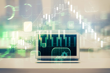 Forex graph hologram on table with computer background. Multi exposure. Concept of financial markets.