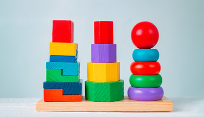 Colorful wooden children's toys on a wooden table.