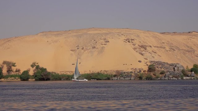 Beautiful landscape with felucca boat on Nile river near Aswan, Egypt, 4k