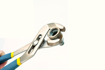 Obraz premium Tool for plumbing. The old coupling is clamped in a wrench. Isolated photo