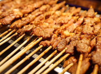 Animal meat on wooden sticks for grilling