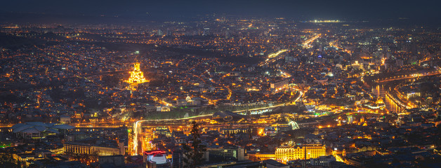 Panorama nightscape view of Tbilisi from mtatsminda pantheon view point. Sakartvelo. Tourist sightseeing in Georgia. Background image. © Evaldas