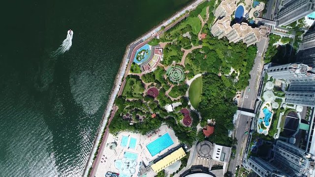 	aerial view of following a boat crossing Shing Mum River, MaOnShan, Hong Kong