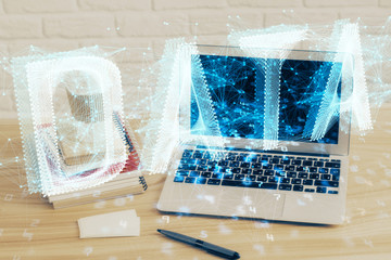 Double exposure of desktop computer and technology theme hologram. Concept of software development.