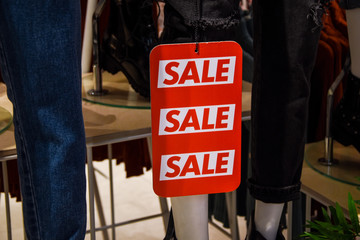 signboard sale with white letters on a red background