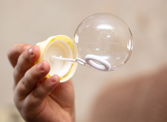 Soap bubble in the hand.