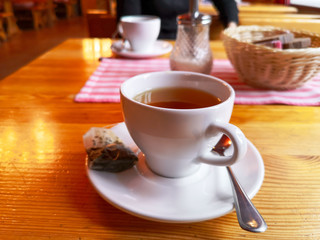 Black tea in a glass on the table