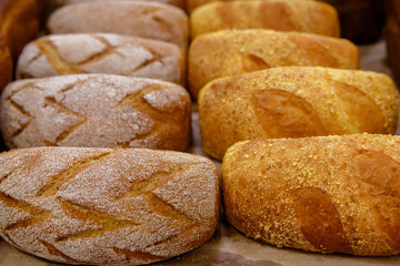 loaves of bread on a shelf or display case in a store