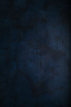 Abstract grunge dark navy blue background, textured. Copyspace.